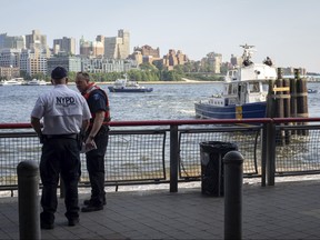 Authorities investigate the death of a baby boy who was found floating in the East River near the Brooklyn Bridge in Manhattan in New York on Aug. 5, 2018.