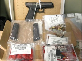 Alberta Law Enforcement Response Team (ALERT) display a variety of drugs, cash and weapons seized during a recent operation in Calgary on Thursday, August 2, 2018.
