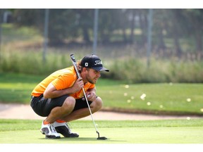 Kiefer Jones lines up a putt at the Winston in northeast Calgary on Tuesday, August 7, 2018. The Calgarian is legally blind and will be playing a the World Blind Golf Championships. Jim Wells/Postmedia