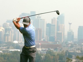 Zach Newhouse warms up for his tee shot on hole 10 at Shaganappi Golf Course overlooking downtown Calgary on Saturday, August 11, 2018. Jim Wells/Postmedia