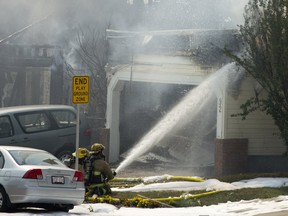 Firefighters at the scene of a multiple house fire on Los Alamos Cres N.E. in Calgary, on Friday August 10, 2018. Leah Hennel/Postmedia