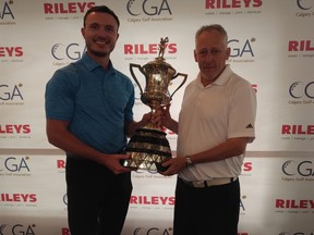 Jesse Galvin (left) earns the Calgary City Amateur trophy after the 2018 tournament. The Calgary Golf Association's Jim Finney hands Galvin the trophy after his victory Sunday.