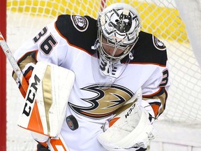 Anaheim Ducks goalie John Gibson stops a puck during a game against the Calgary Flames on March 21, 2018 at the Saddledome in Calgary.