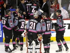 Calgary Hitmen L-R, Nick Schneider and Jakob Stukel have words after losing their last game as Hitmen to the Edmonton Oil Kings at the Scotiabank Saddledome in Calgary on Sunday, March 18, 2018. Darren Makowichuk/Postmedia