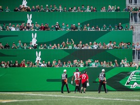 Calgary Stampeders defensive back Emanuel Davis (8) is escorted off the field after being ejected from the game during second half CFL action against the Saskatchewan Roughriders, in Regina on Sunday, August 19, 2018. The Saskatchewan Roughriders defeated the Calgary Stampeders 40-27. THE CANADIAN PRESS/Matt Smith ORG XMIT: MBS122