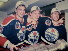 May 24, 1990. Nicknamed after the 1929 to 1936 Toronto Maple Leafs threesome the Edmonton Oilers, 1990 Stanley Cup play-off champions, Kid-line left to right, consisted of 21-year olds Joe Murphy, Adam Graves and 19-year-old Martin Gelinas celebrate their win in the Oilers dressing room on May 24, 1990 after the Oilers beat the Boston Bruins in five games. Photo Supplied/Family