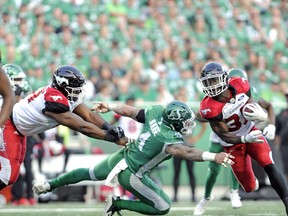 Calgary Stampeders running back Romar Morris shakes a tackle during first half CFL action against the Saskatchewan Roughriders at Mosaic Stadium in Regina on Friday, July 28, 2018. THE CANADIAN PRESS/Mark Taylor ORG XMIT: MT105