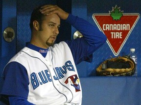 Toronto Blue Jays pitcher Esteban Loaiza rubs his head after being pulled from the game against the Cleveland Indians in the eighth inning during MLB action at the SkyDome in Toronto, Saturday, May 25, 2002.