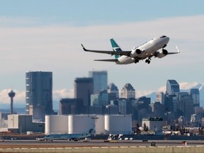 A WestJet Boeing 737 takes off from Calgary International Airport.