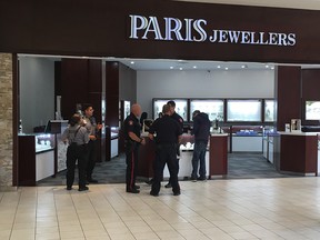 Police on scene after a robbery at Paris Jewellery in Sunridge Mall. Photo by Ryan Rumbolt, Postmedia Network