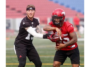 Calgary Stampeders, Bo Levi Mitchell and team deal with thick smoke and heat during practice at McMahon stadium in Calgary on Thursday August 16, 2018. Darren Makowichuk/Postmedia