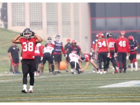 Calgary Stampeders, Terry Williams and team deal with thick smoke and heat during practice at McMahon stadium in Calgary on Thursday August 16, 2018. Darren Makowichuk/Postmedia