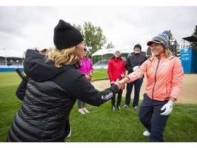 Brooke Henderson (right) meets Olympian Catriona Le May Doan during Women's Day at the Shaw Charity Classic in Calgary, Alberta, August 27, 2018. Photograph by Todd Korol/Shaw Charity Classic