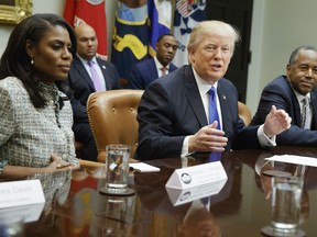 In this Feb. 1, 2017, file photo, President Donald Trump speaks during a meeting on African American History Month in the Roosevelt Room of the White House in Washington. From left are, Omarosa Manigault, Trump, and then-Housing and Urban Development Secretary-designate Ben Carson.