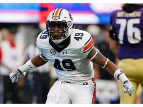 ATLANTA, GA - SEPTEMBER 01:  Darrell Williams #49 of the Auburn Tigers reacts after a defensive stop against the Washington Huskies at Mercedes-Benz Stadium on September 1, 2018 in Atlanta, Georgia.