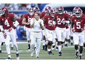 ORLANDO, FL - SEPTEMBER 01: Head coach Nick Saban of the Alabama Crimson Tide brings his team onto the field prior to the game against the Louisville Cardinals at Camping World Stadium on September 1, 2018 in Orlando, Florida.
