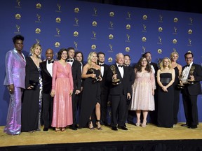 Lorne Michaels, centre, and the cast and crew from "Saturday Night Live" pose backstage with the award for outstanding variety sketch series at the 70th Primetime Emmy Awards, at the Microsoft Theater in Los Angeles, on Monday, Sept. 17, 2018.