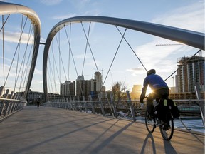 A cyclist cruises over St. Patrick's Bridge to East Village.