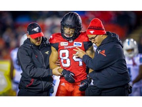 Calgary Stampeders receiver Reggie Begelton is help off the  field after being injured in a game against the Toronto Argonauts during CFL football in Calgary on Friday, September 28, 2018. Al Charest/Postmedia