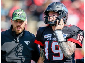 Calgary Stampeders quarterback Bo Levi Mitchell is helped off the field after suffering leg injury against the Edmonton Eskimos during the Labour Day Classic in Calgary on Monday, September 3, 2018. Al Charest/Postmedia