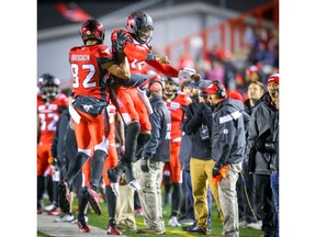 Calgary Stampeders' Juwan Brescacin celebrates with teammate Montell Cozart after his touchdown against the Toronto Argonauts during CFL football in Calgary on Friday, September 28, 2018. Al Charest/Postmedia