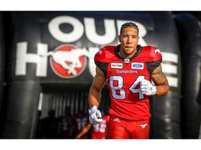 Reggie Begelton of the Calgary Stampeders runs onto the field during player introductions before facing the Ottawa Redblacks in CFL football on Thursday, June 28, 2018. Al Charest/Postmedia