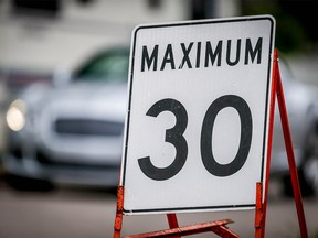 Council will debate a notice of motion seeking to lower the speed limit on some neighbourhood streets. Al Charest/Postmedia