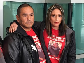 Alex Baptiste, brother of slain Calgary mom Dawns Echoes Baptiste, and cousin Louise Baptiste outside  the Calgary Courts Centre on Monday, Sept. 24, 2018.