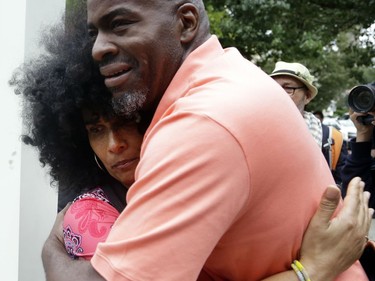 Accuser Lili Bernard, who has said she was drugged and raped by Bill Cosby in the 1990s, hugs a man who apologized to her for being aggressive toward her at a previous Cosby hearing, outside theMontgomery County Courthouse in Norristown, Pa., Monday, Sept. 24, 2018. Cosby faced the start of a sentencing hearing Monday at which a judge will decide how to punish the 81-year-old comedian who blazed the trail for other black entertainers and donated millions to black causes but preyed on at least one young woman and perhaps many more.