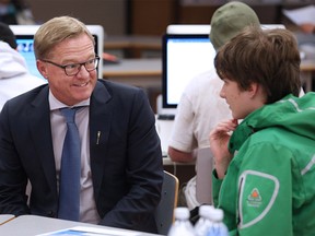 Alberta Education Minister David Eggen talks with Dr. E.P. Scarlett students taking part in the Calgary Board of Education's Worktopia program on Wednesday September 12, 2018. The unique program helps autistic high school kids prepare for graduation by giving them a chance to learn workplace skills. Gavin Young/Postmedia