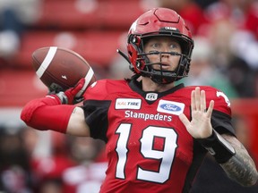 Calgary Stampeders quarterback Bo Levi Mitchell throws the ball during first half CFL football action against the Hamilton Tiger-Cats in Calgary, Saturday, June 16, 2018. THE CANADIAN PRESS/Jeff McIntosh