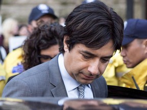 Former CBC radio host Jian Ghomeshi leaves a Toronto court after signing a peace bond, on May 11, 2016.