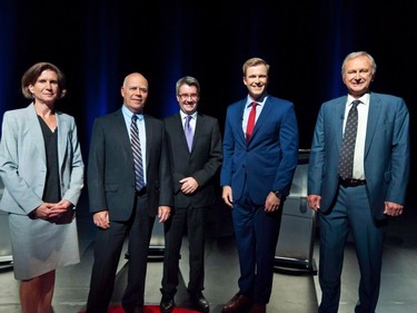 NDP Leader Jennifer McKenzie, left to right, Green Party Leader David Coon, People's Alliance Leader Kris Austin, Liberal Leader Brian Gallant and PC Leader Blain Higgs pose for photos before the start of the New Brunswick leaders debate in Riverview, N.B., Wednesday, Sept. 12, 2018. New Brunswick voters go to the polls today in a provincial election that appears to be a tight race between the incumbent Liberals and the Progressive Conservatives.