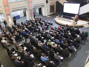 A large noon hour audience fills the lobby of the Jack Singer Concert Hall in downtown Calgary on Thursday, September 20, 2018 for a public engagement session for the Calgary 2026 Olympic bid.