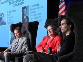 (L-R) John Adams, Executive Assistant Director, Information and Technology Branch, FBI, Janice Hamby, Past Chancellor, US National Defense University College of Information and Cyberspace, and Dr Chris White, Principal Reasearcher and Partner, Microsoft are shown a session during the 2018 Global Business Forum at the Fairmount Banff Springs in Banff, Alberta on Thursday, September 27, 2018. Jim Wells/Postmedia