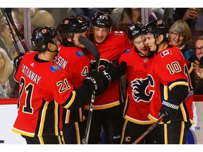 Calgary Flames Juuso Valimaki celebrates with teammates after scoring against the Winnipeg Jets in NHL pre-season hockey at the Scotiabank Saddledome in Calgary on Monday, September 24, 2018. Al Charest/Postmedia