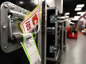 Calgary Flames baggage tagged for China is stacked in a hallway at the Scotiabank Saddledome on Monday, Sept. 10, 2018.