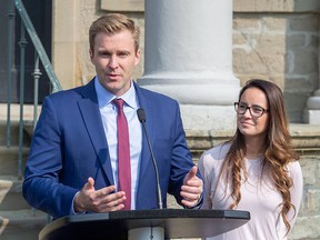New Brunswick Liberal Leader Brian Gallant and wife Karine Lavoie, right, addresses the media after meeting with Lieutenant Governor of New Brunswick Jocelyne Roy-Vienneau, in Fredericton on Tuesday, Sept. 25, 2018.