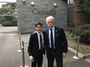 Calgary Flames legend Lanny McDonald and his grandson, Hayden Townsley, pose for a keepsake photo at the Canadian Embassy in Beijing.