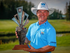 Scott McCarron poses with the Shaw Charity Classic championship trophy after winning the 2018 PGA event in Calgary on Sunday, Sept. 2, 2018.