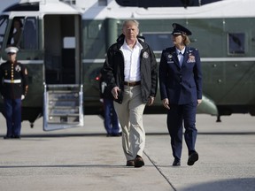 President Donald Trump walks to board Air Force One for a trip to tour areas impacted by Hurricane Florence, Wednesday, Sept. 19, 2018, in Andrews Air Force Base, Md.