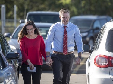 New Brunswick Liberal Leader Brian Gallant and his wife Karine Lavoie arrive at a polling station to vote in the provincial election in Dieppe, N.B., on Monday, Sept. 24, 2018.