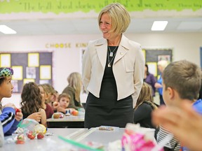 Premier Rachel Notley visits with students at Banting and Best School in Calgary on Wednesday, Sept. 26, 2018. Notley announced an expansion of the province's school nutrition program.