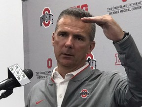 Ohio State NCAA college football head coach Urban Meyer gestures while speaking at a press conference in Columbus, Ohio, Monday, Sept. 17, 2018.