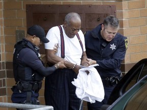 Bill Cosby is escorted out of the Montgomery County Correctional Facility, Tuesday Sept. 25, 2018, in Eagleville, Pa., following his sentencing to three-to-10-year prison sentence for sexual assault.