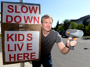 Garrison Wood resident, Kris Norman is in favor of the 30 km/h speed limit limit after monitoring traffic in his community in Calgary on Wednesday September 5, 2018. Darren Makowichuk/Postmedia