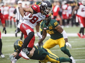 Calgary Stampeders Reggie Begelton runs the ball against the Edmonton Eskimos in Edmonton on Saturday, Sept. 8, 2018.