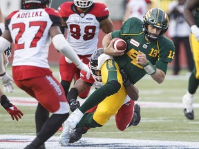 Edmonton Eskimos quarterback Mike Reilly runs the ball against the Calgary Stampeders on Saturday, Sept. 8, 2018.