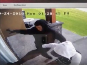 A screen grab from a homeowners security footage shows two men breaking into a Thorncliffe home in Calgary on Monday, Sept. 24, 2018.