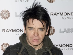 FILE - In this Jan. 26, 2012, file photo, British singer Gary Numan arrives for the Pre-Brit Awards Dinner at a London venue. Police say a tour bus carrying Numan struck and killed a 91-year-old man in Cleveland, on Monday, Sept. 24, 2018. Authorities say Numan's tour bus was making a right turn when it struck the victim as he walked in a crosswalk.